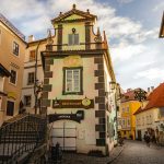 a cobblestone street lined with old buildings
